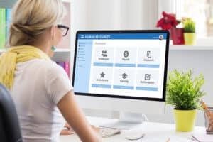 Woman working with human resources software on computer, learn the future of hiring