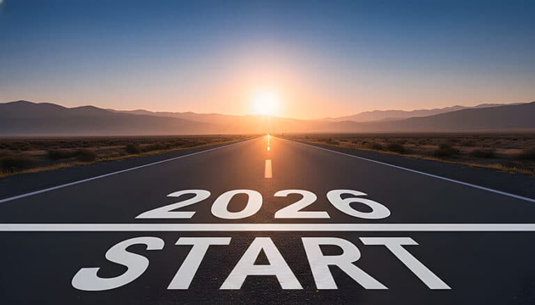 2026 written on road in middle of asphalt road at sunset