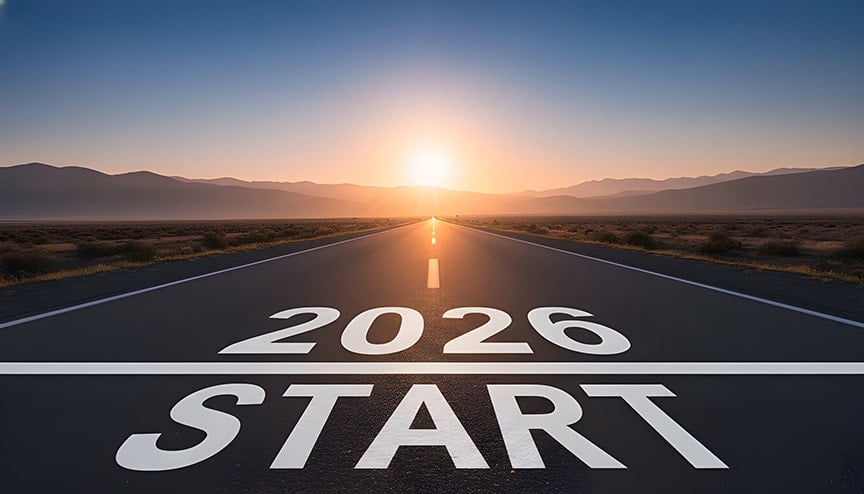2026 written on road in middle of asphalt road at sunset