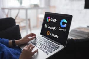 person using laptop with AI logos on screen