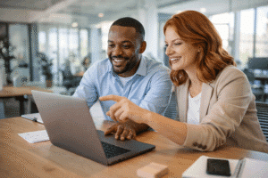 Two professionals collaborating on a project in modern office setting fractional hiring